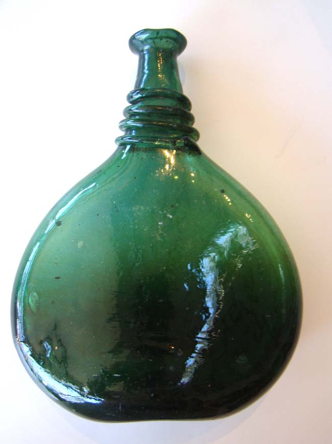 A wonderful late 18th or early 19th century hand blown Persian Saddle Flask